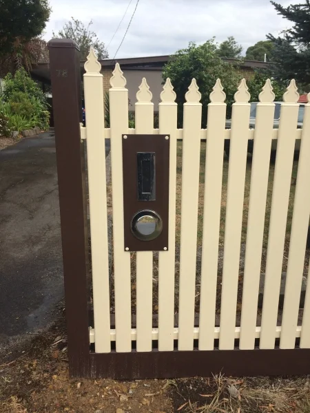 Cream steel picket fence with brown letterbox, posts and bottom rail - Geelong