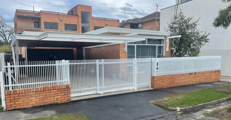White steel blade fence and telescopic sliding gate